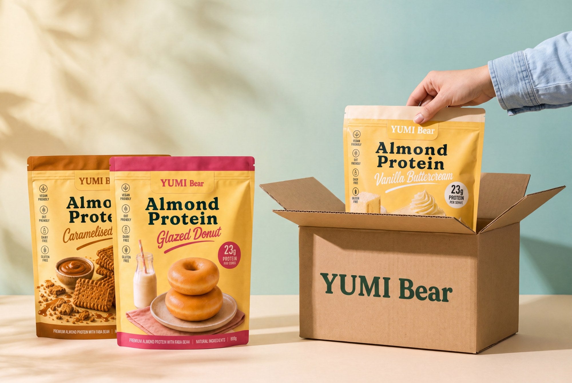 YUMI Bear Almond Protein bags being packed into a branded delivery box